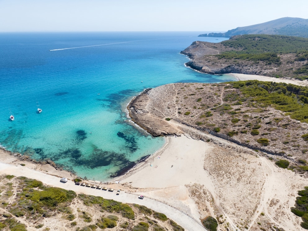 Surrounded by rocks and dunes lies the unspoiled and popular beach Cala Torta