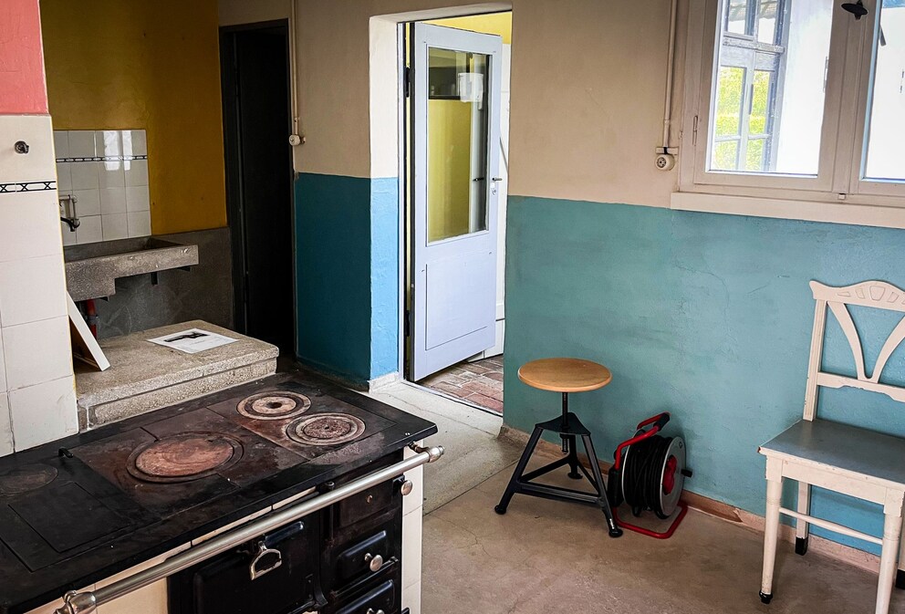 Interior view of House Anton – original kitchen with wood stove