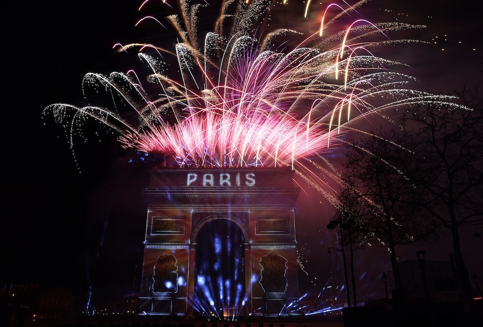 Paris celebrates with lights, music, and fireworks – and the Arc de Triomphe becomes a legendary screen