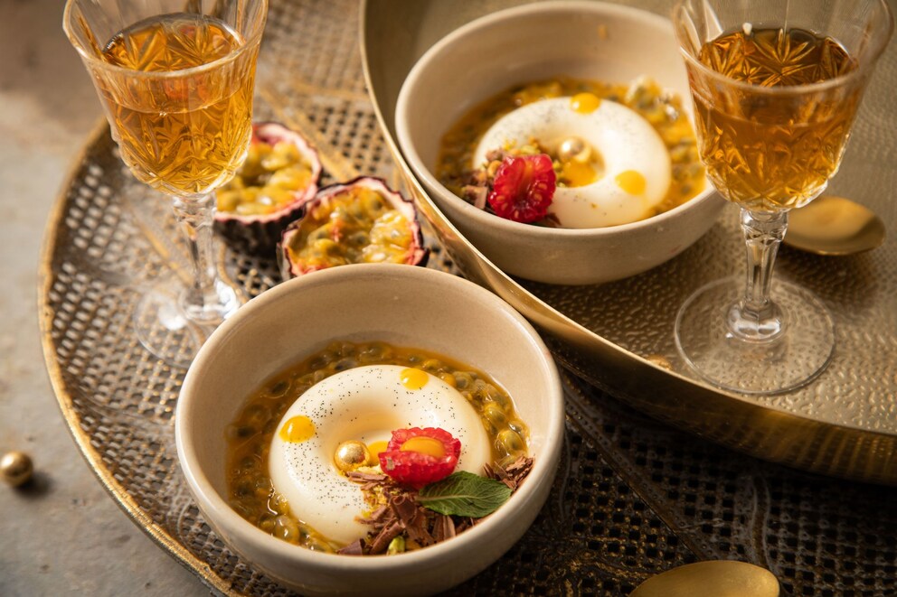Panna Cotta in savarin mold, passion fruit, raspberry, mango dots
