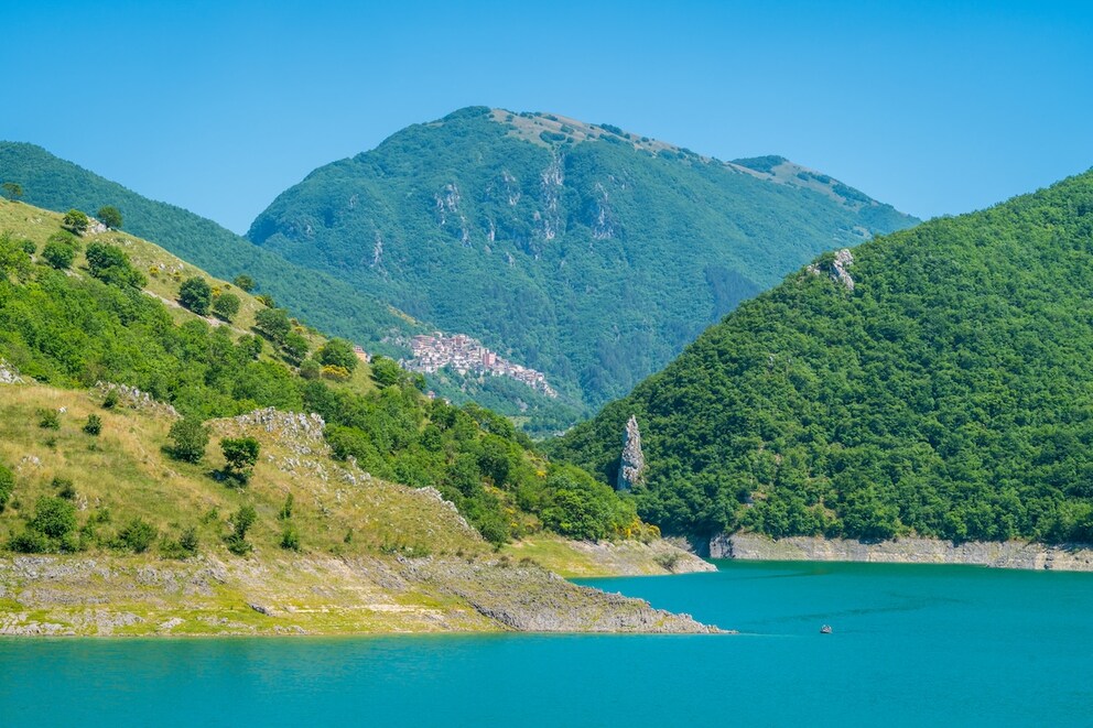Panoramic view of Lake Turano with the medieval village of Castel di Tora in the distance