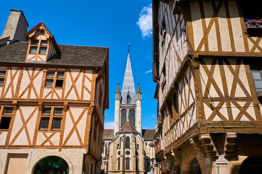 The Church of Notre Dame between traditional half-timbered houses